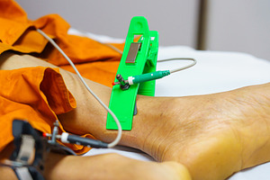 ECG or EKG of man with electrodes for electrocardiogram records, a Health & Medical Photo by Casanowe-studio