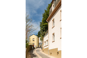 Steep narrow street in Luxembourg city, an Architecture Photo by Leonid Andronov
