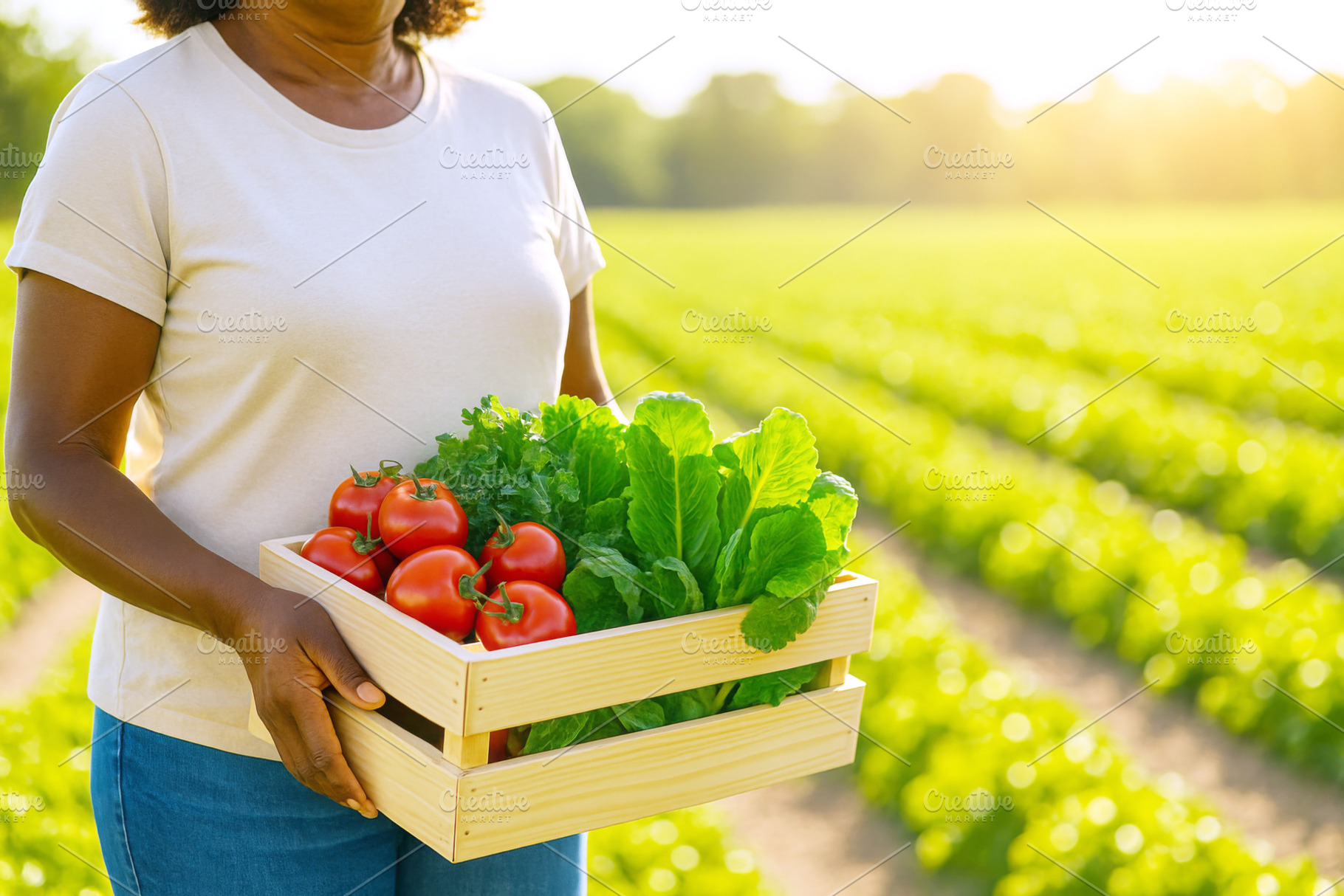 Woman farmer holding crate of fresh vegetables in sunny field, i, a Photo by Dvoevnore photos