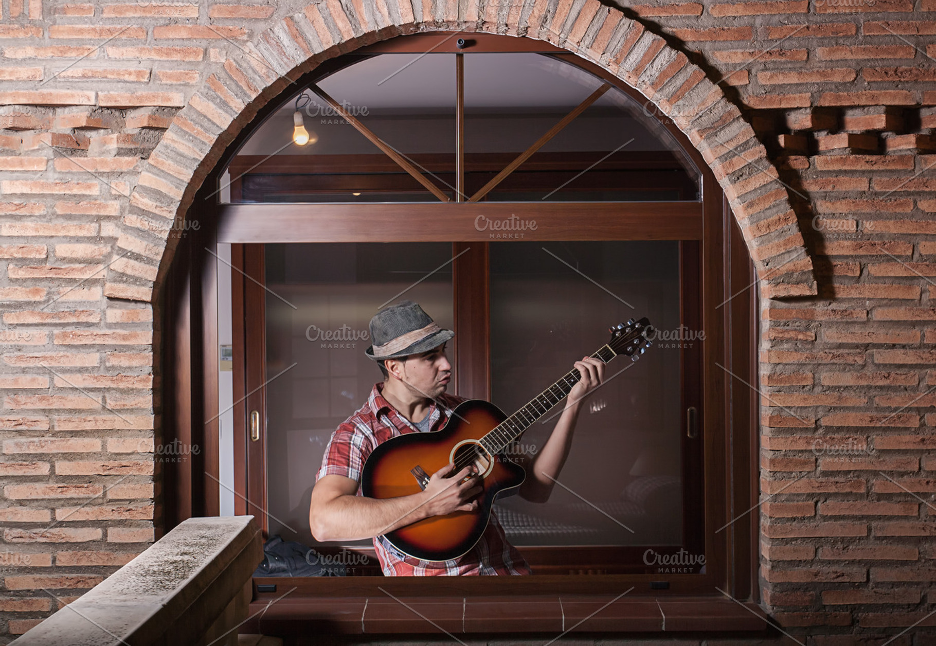 Man playing guitar containing lifestyle, rhythm, and stage, a Person Photo by robcar