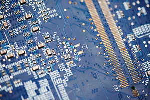 Macro view of blue circuit board with gold contacts and electronic components., a Technology Photo by Rohan Photography