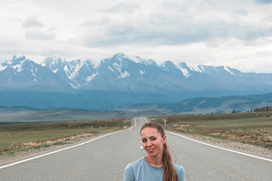 Woman sitting on the road featuring daydreaming, woman, and beautiful, a Person Photo by Jan Jack Russo Media