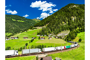 Trucks crossing the Alps by rail in, a Transportation Photo by Leonid Andronov