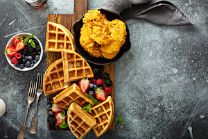 Breakfast platter with waffles, berries and chicken, a Food & Drink Photo by farwasser