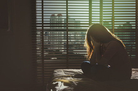 depressed Women sitting head in hand