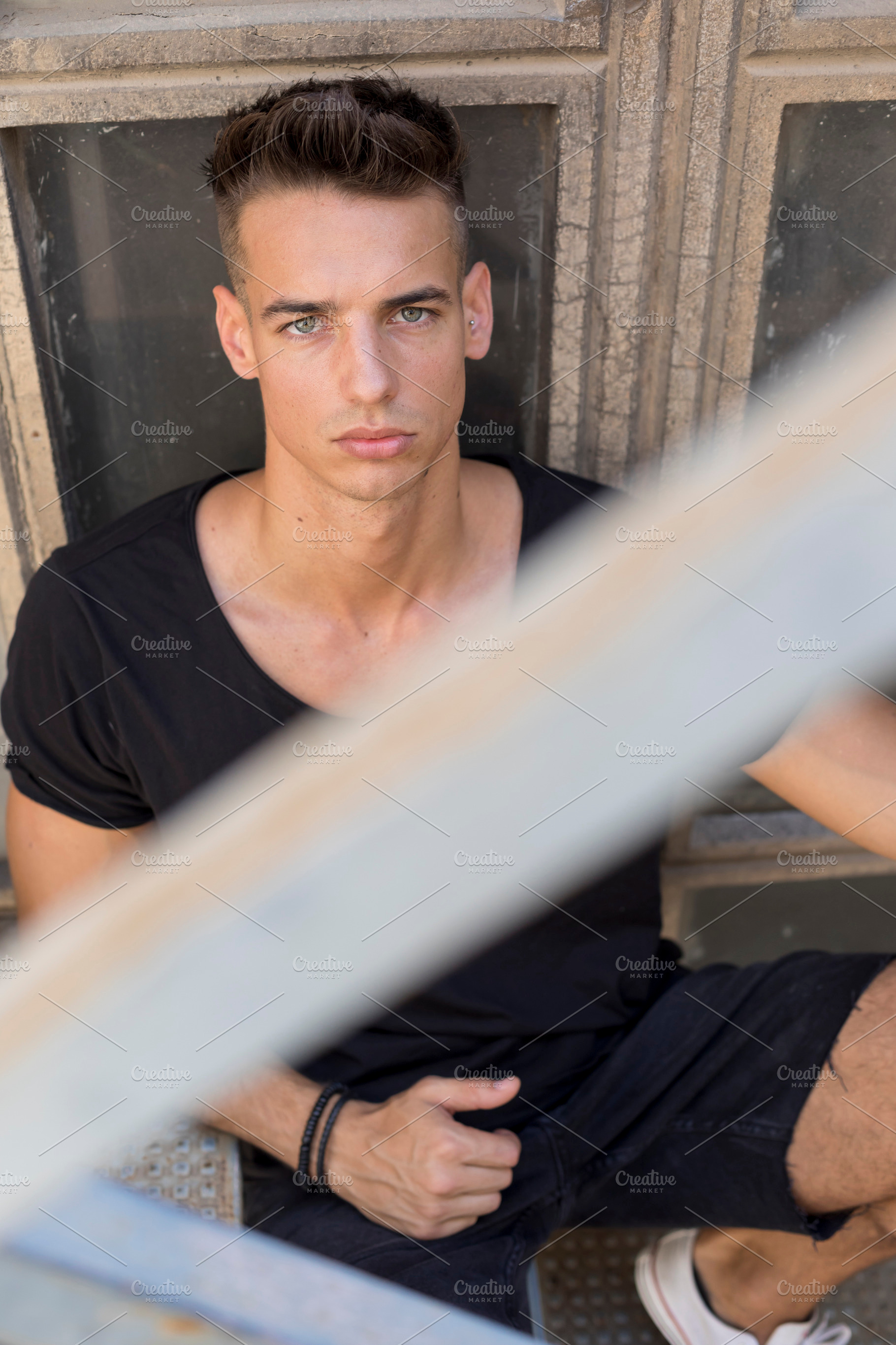 Serious young man posing in sunlight outdoors, a Person Photo by RF Images