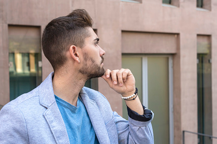 Young bearded man, model of fashion, in urban background wearing casual clothes, a Person Photo by RF Images