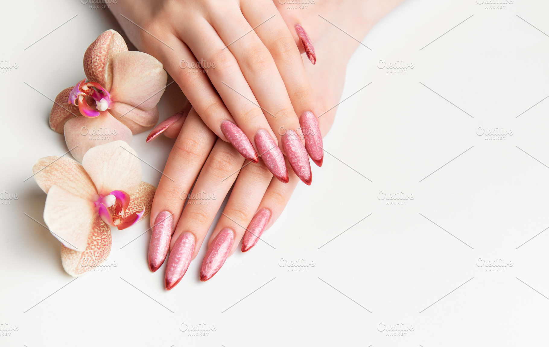 Woman's hands showing manicure with pink glitter nails and orchi, a Beauty & Fashion Photo by Olena Rudo