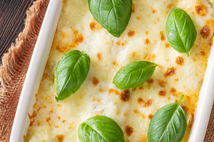 Rustic Lasagna Bolognese In Ceramic Baking Dish With Golden Chee, a Food & Drink Photo by Alexander Prokopenko