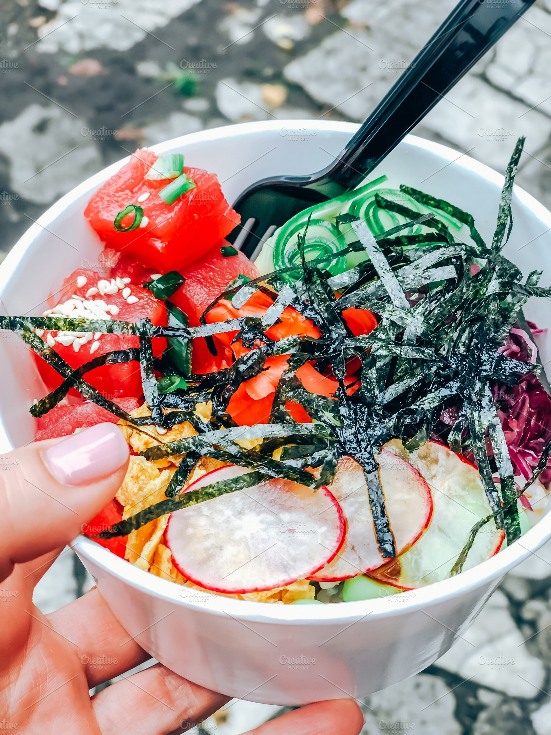 Poke bowl with tuna fish in paper container, a Food & Drink Photo by Dvoevnore photos