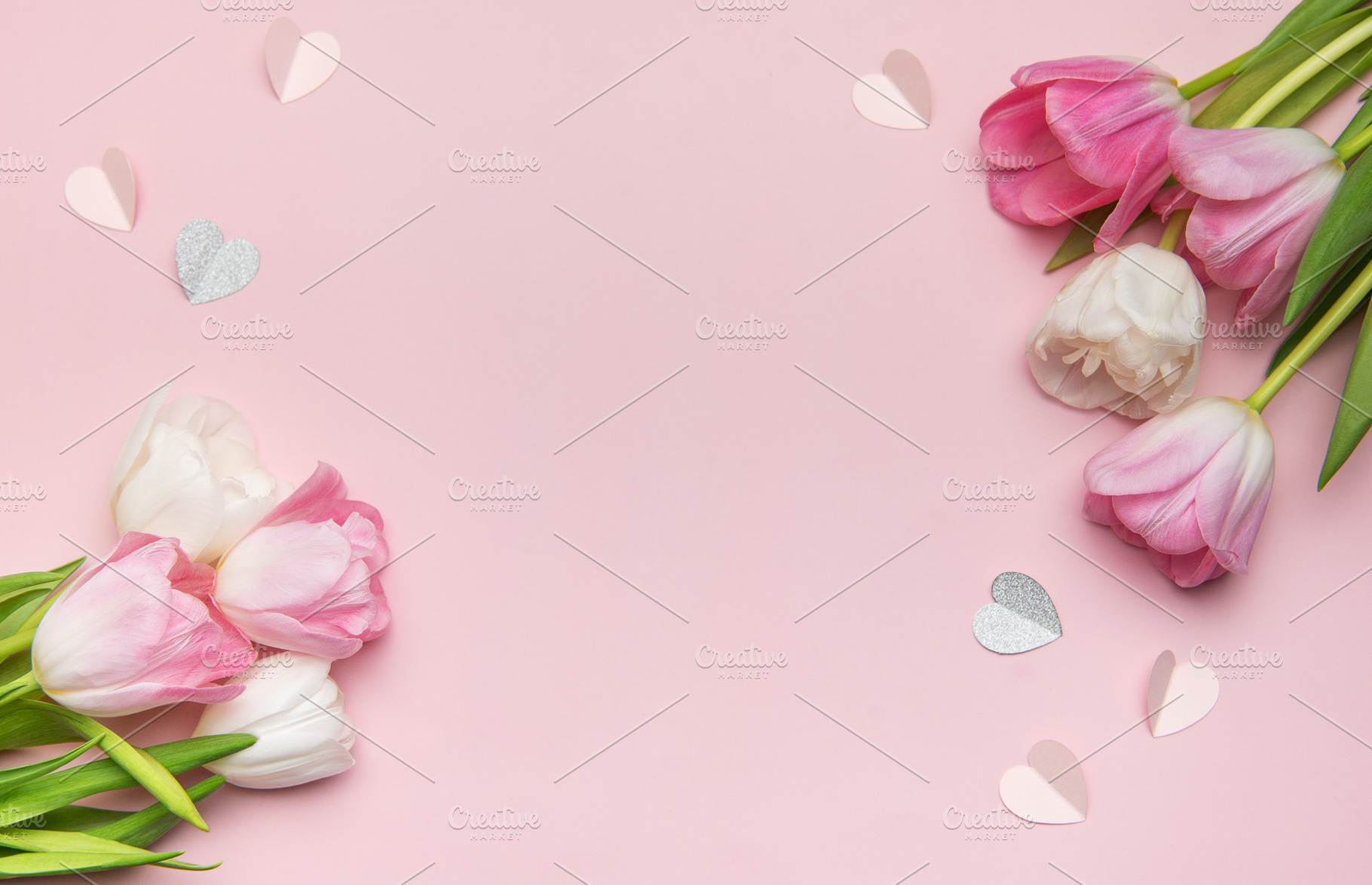 Pink and white tulips forming a border with paper hearts on a pi, a Nature Photo by Olena Rudo