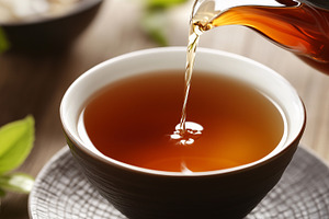 Steaming cup of fresh tea poured, a Food & Drink Photo by MistyDay
