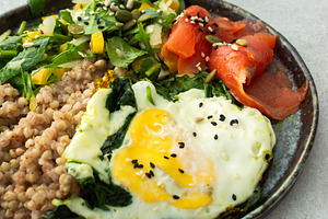 Buckwheat with fried egg and salmon, a Food & Drink Photo by Pundateam