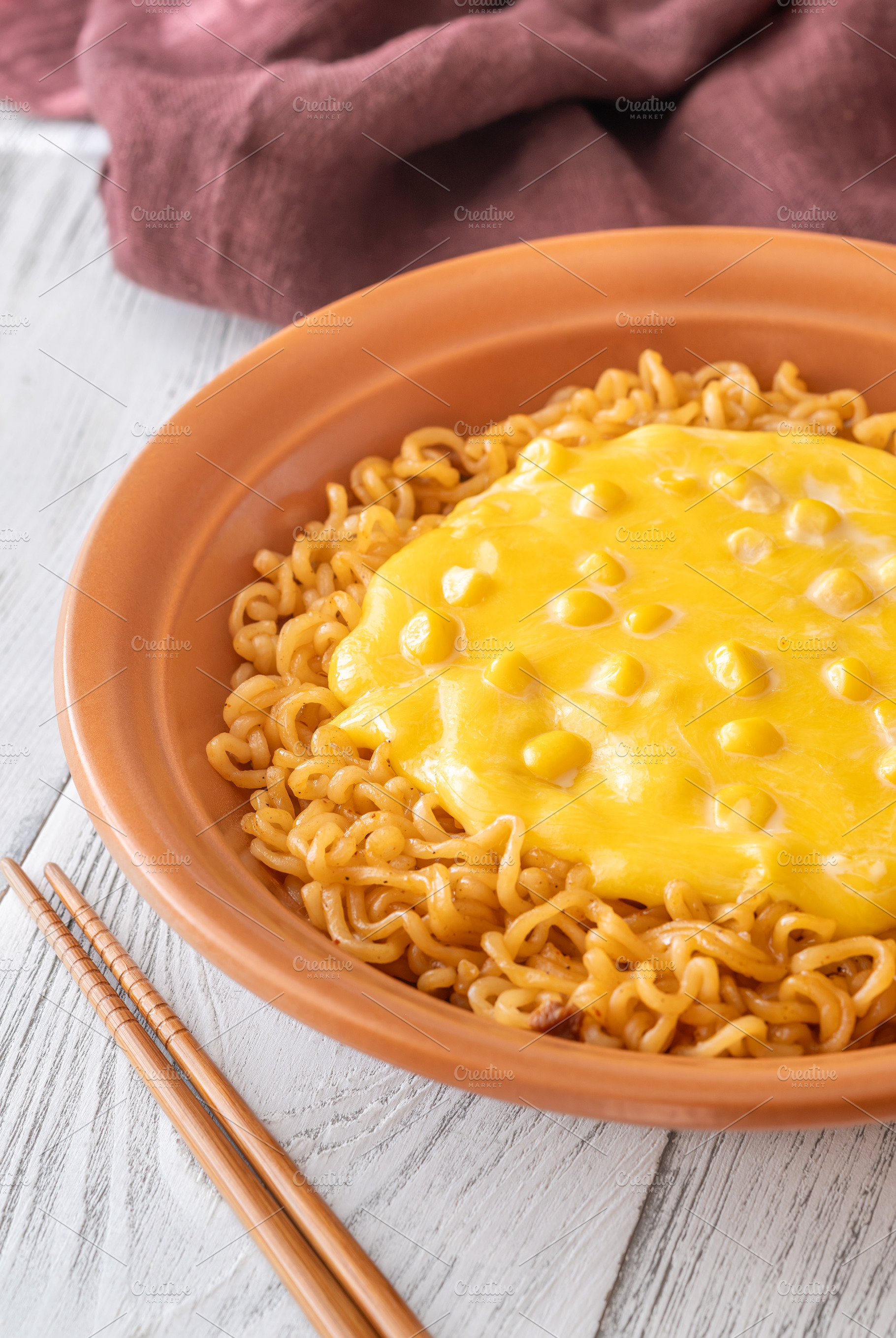 Cheesy Korean ramen with sweet corn and creamy melted cheese in, a Food & Drink Photo by Alexander Prokopenko