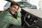 Delighted young man sitting in driver's seat, hugging steering wheel of his new, a Photo by Prostock-Studio (Thumbnail 2 of 2)