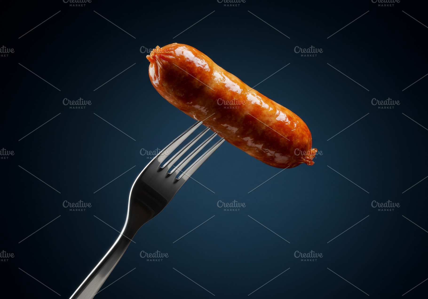 Grilled sausage on a silver fork aga, a Food & Drink Photo by professorinc