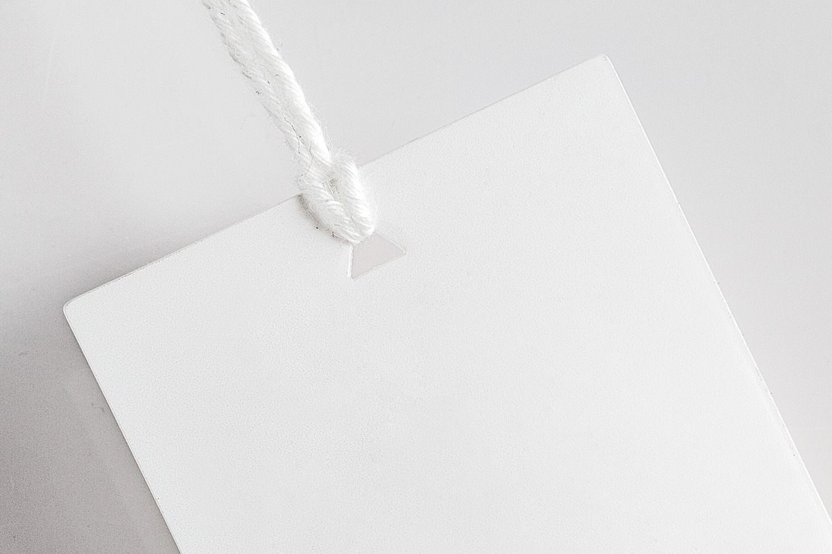 Clothes label tag blank white mockup, an Advertising Mockup by Olha Klein (Photo 3 of 3)