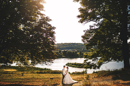Couple in love standing near lake, a Person Photo by IvashStudio