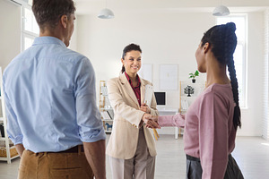 Realtor Greeting Couple at Viewing