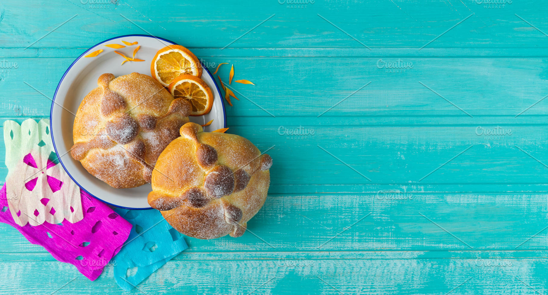 Pan de muerto on blue background., a Food & Drink Photo by Mineko