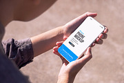 Woman in Park Holding Phone Mockup, an iPhone Mockup by SimplDesign (Thumbnail 2 of 2)