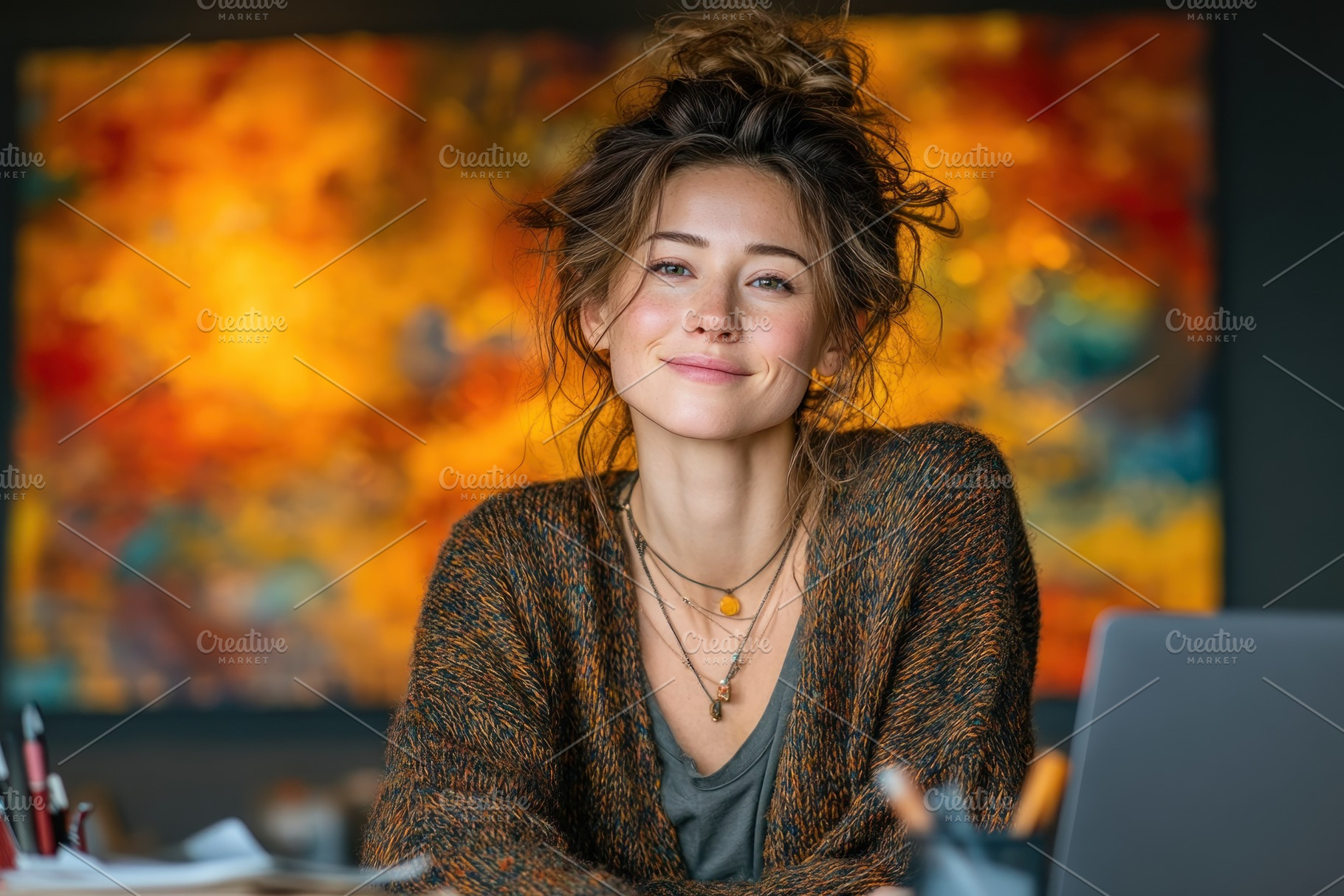 Smiling Creative Woman Working on Laptop in Art Studio with Vibr, a Person Photo by José Manuel Gelpi
