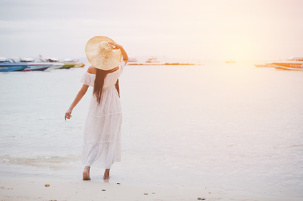 Asian woman on beach enjoying travel and fresh air in holidays., a Person Photo by Ministocker