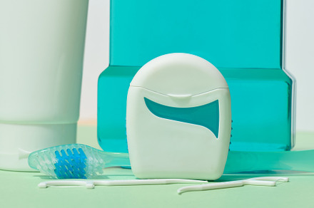 Various dental hygiene products, including dental floss, toothbr