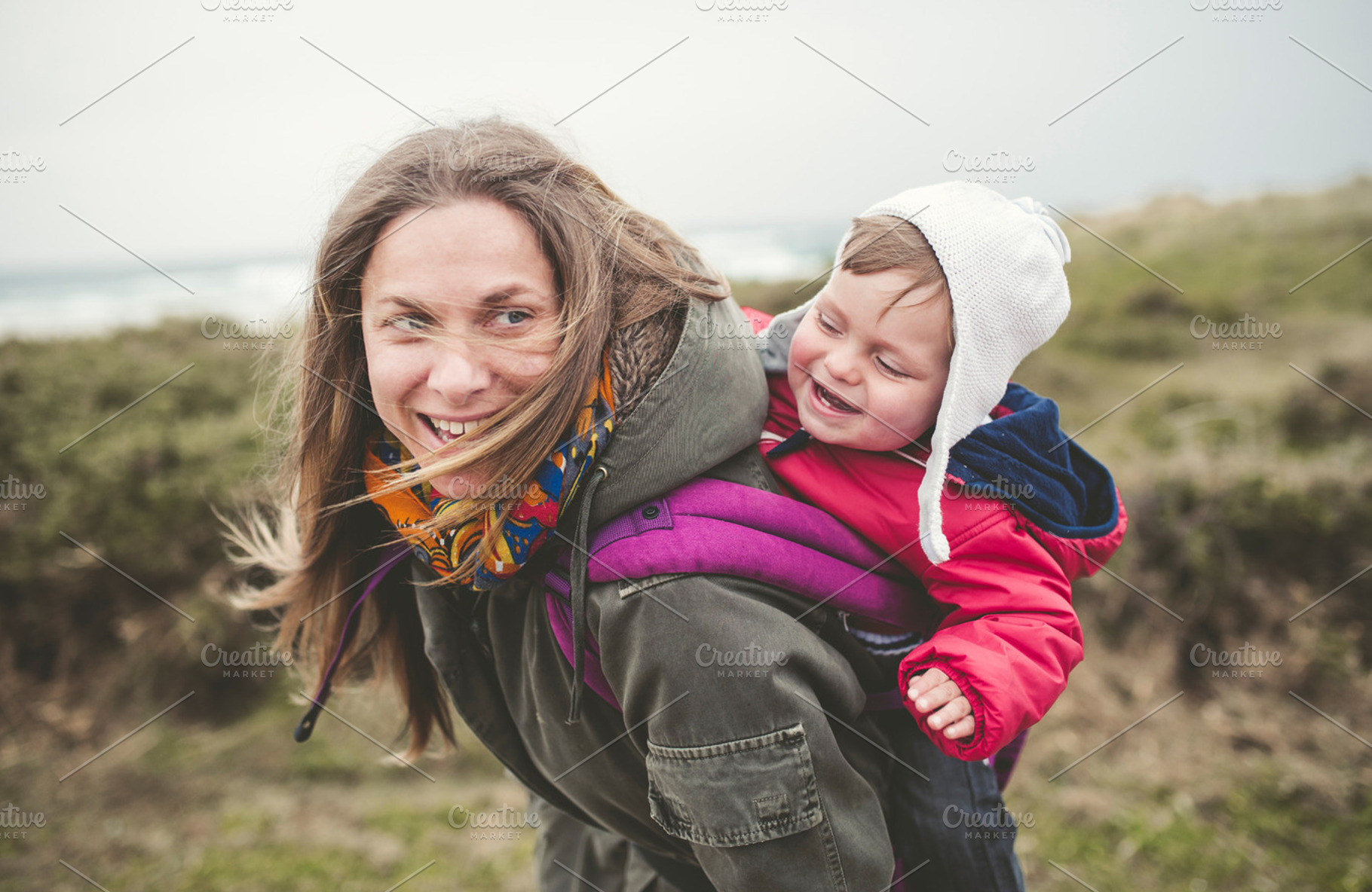 Mother carrying her toddler stock photo containing baby and family, a Person Photo by Photoweb00