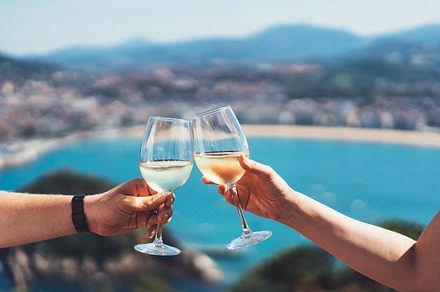 Two groceries with white wine featuring wine, drink, and glass