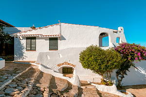 steps and white houses in La Almadrava, Spain, a Photo by Nito