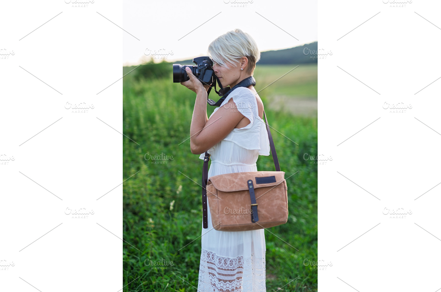 Side view of female photographer, a Person Photo by HalfPoint