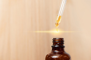 Closeup drop of oil restore and rec stock photo containing hair and oil