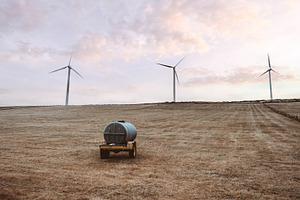 Wind turbines at sunset field, an Industrial Photo by SkyNext