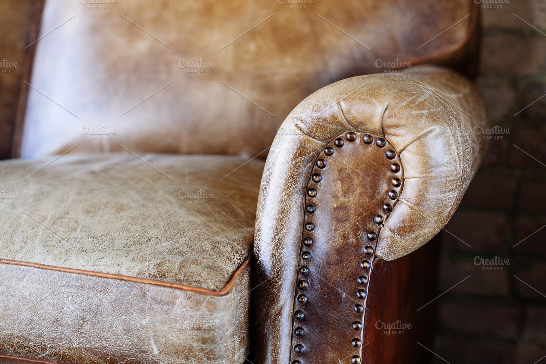 Closeup texture of leather sofa featuring antique, armchair, and back, an Architecture Photo by telnyaw