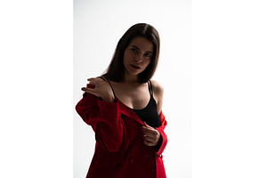 Woman standing in a studio, modeling, a Person Photo by volodymyrshtun13795