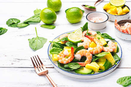 Shrimp pineapple salad with spinach, avocado and lime on white w, a Food & Drink Photo by 5PH