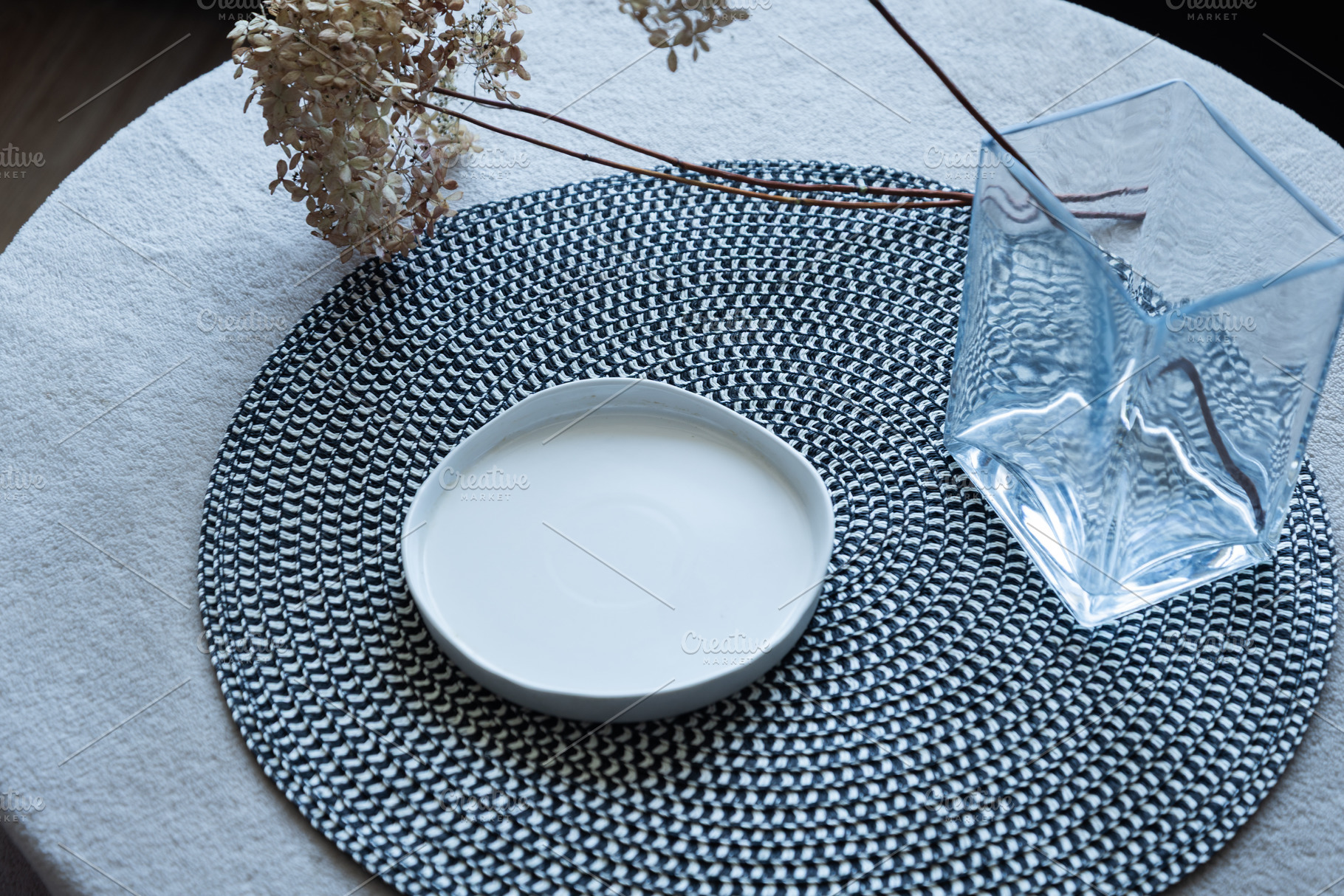 Empty ceramic plate on table with woven placemat, an Industrial Photo by MDBildes