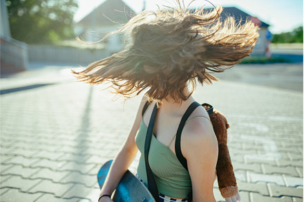 Teenager girl with skateboard, a Person Photo by HalfPoint