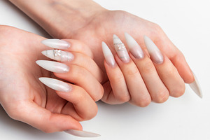 Woman's hands showing long white stiletto nail art manicure, a Beauty & Fashion Photo by Olena Rudo