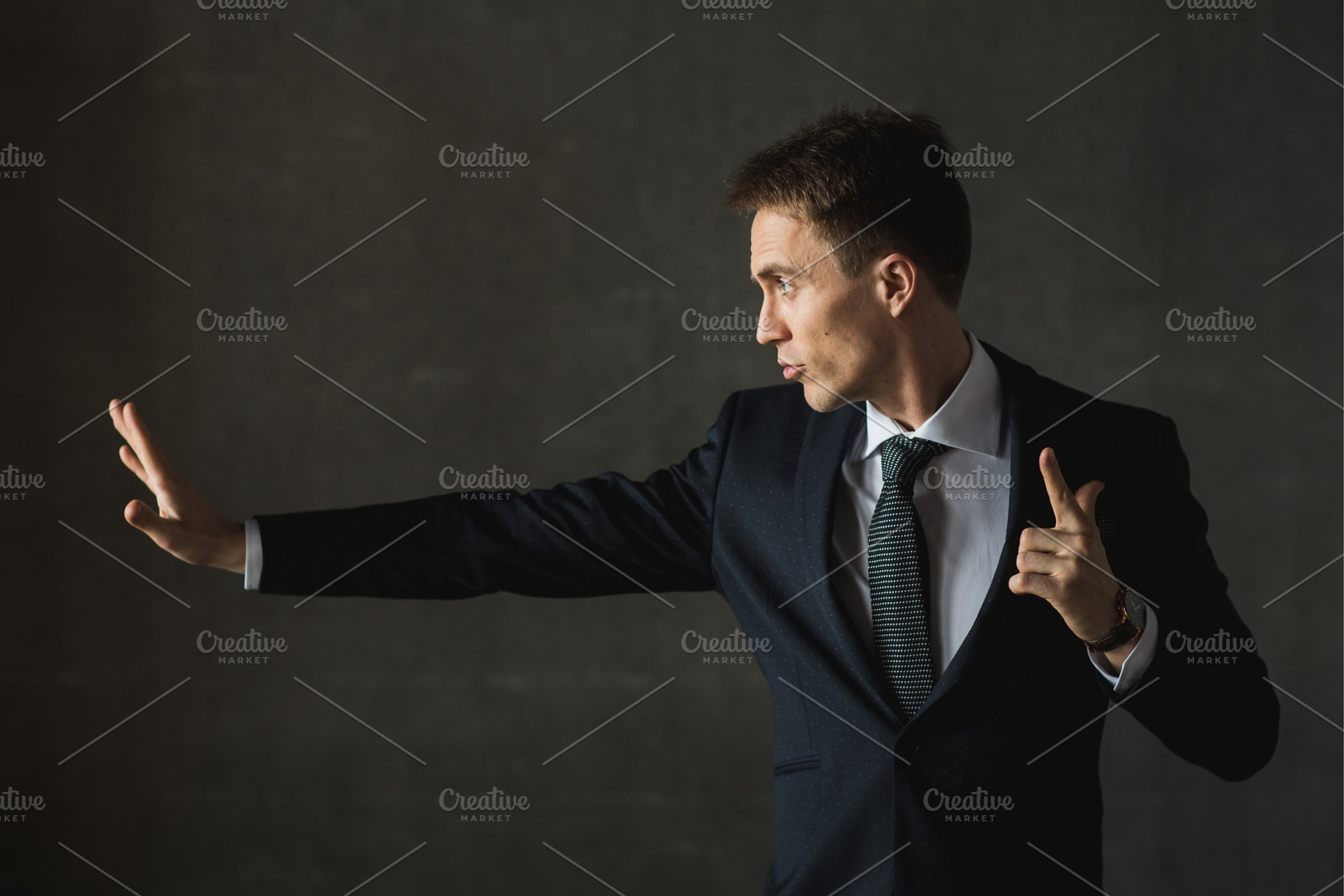 Young businessmen in black suit emotional posing containing businessman, a Person Photo by IlyaMarchenko