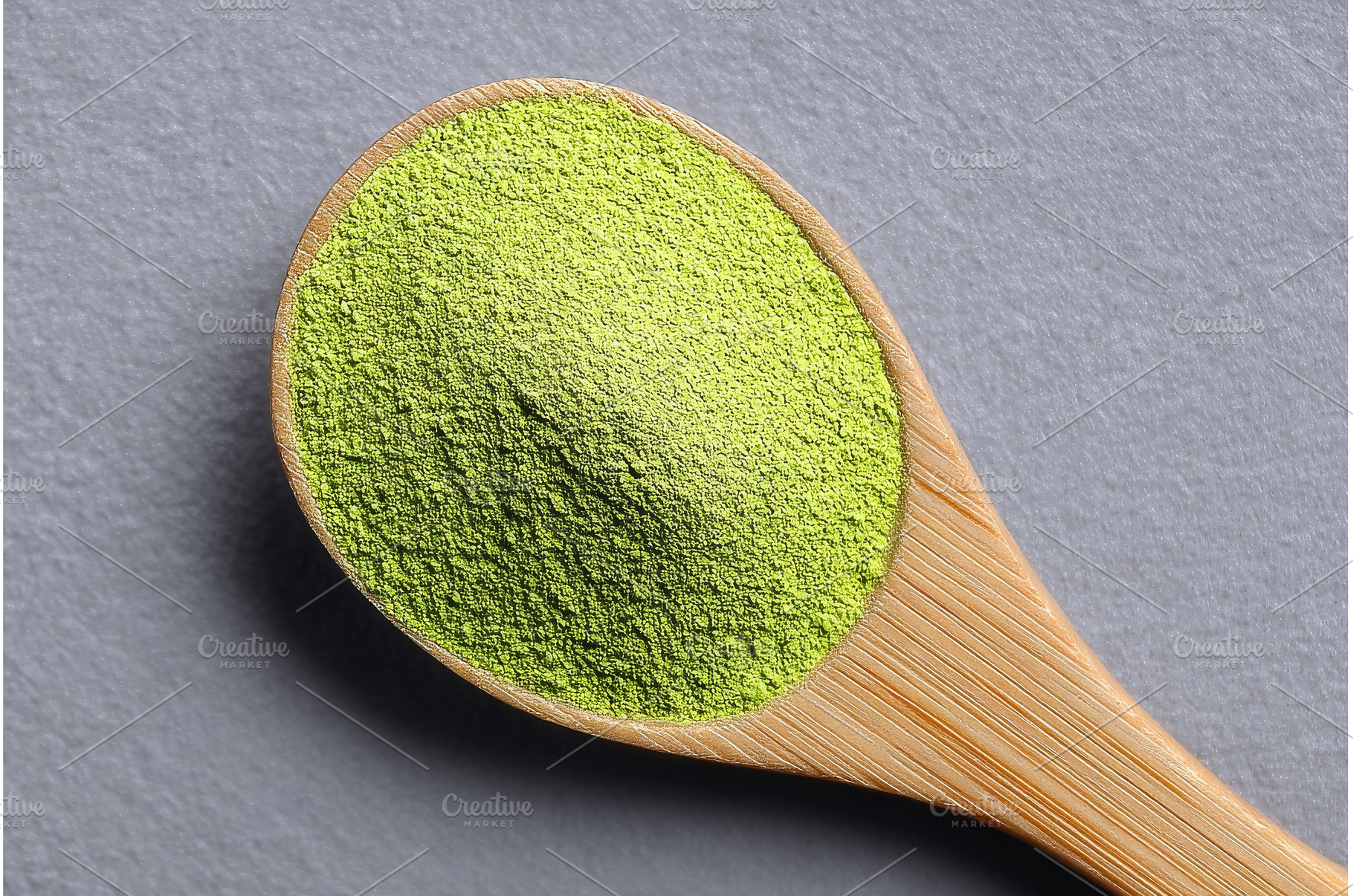 Green barley grass powder sits on a, a Food & Drink Photo by ZinetroN