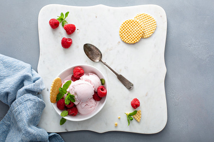 Raspberry ice cream in a bowl with fresh berries, a Food & Drink Photo by farwasser