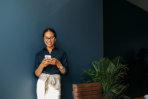 Smiling businesswoman typing, a Business Photo by Artem Varnitsin