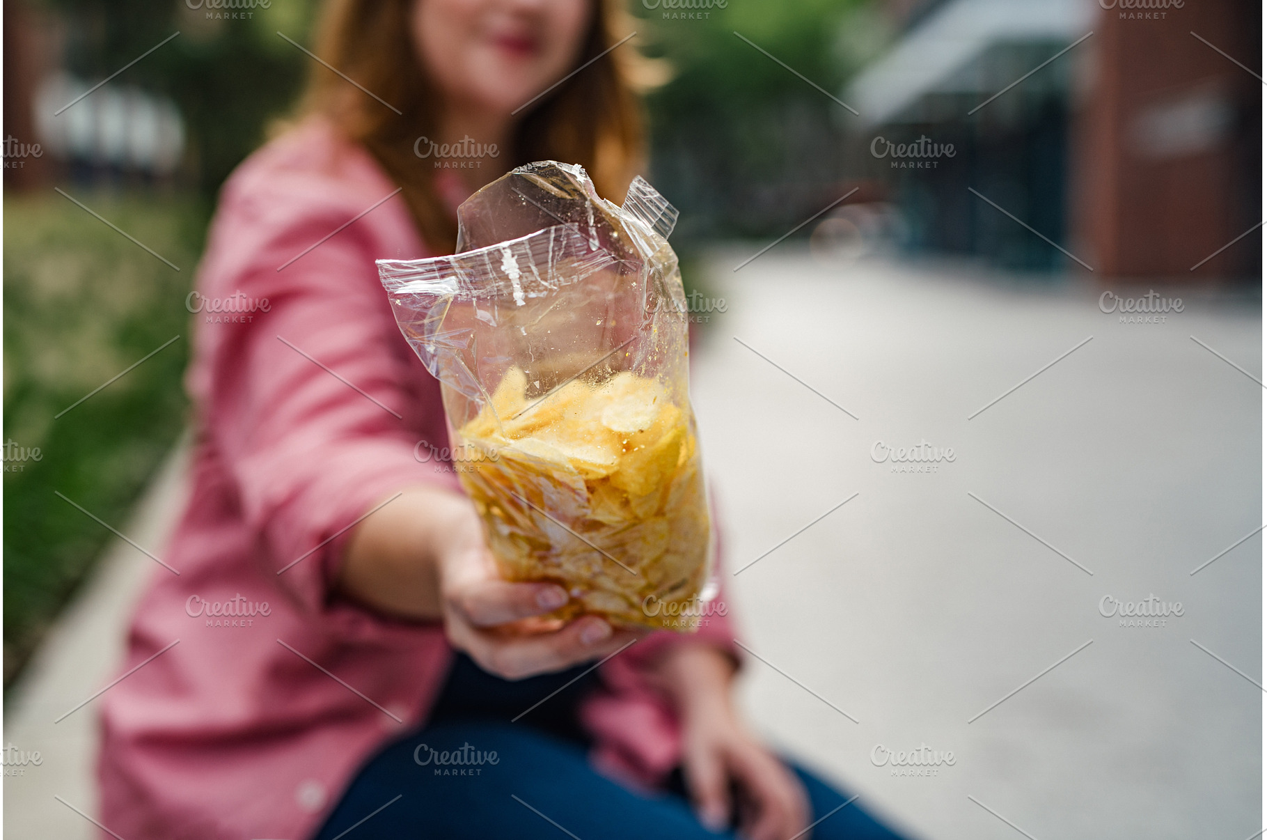Overweight woman holding bag of, a Person Photo by HalfPoint