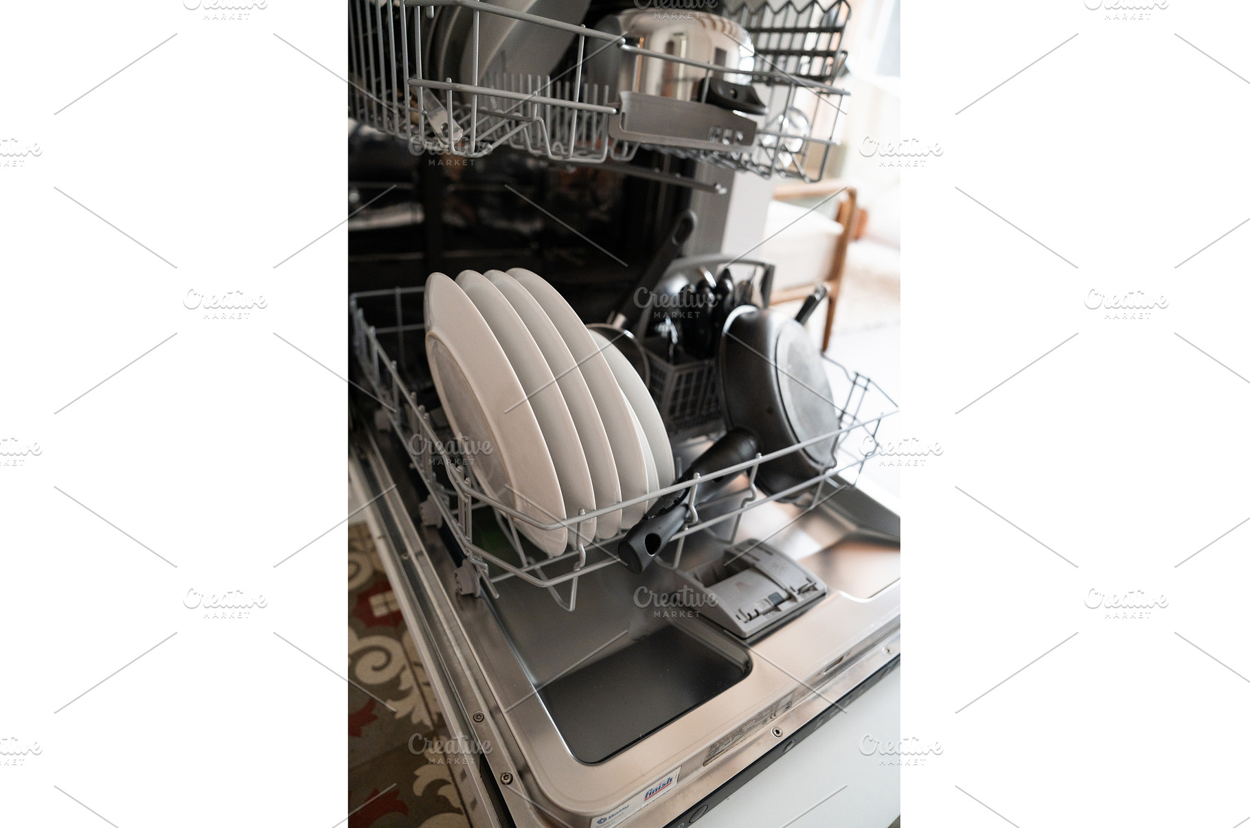 Dishwasher rack full of clean white, a Technology Photo by volodymyrshtun13795