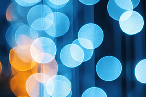 Vertical strands of glowing blue and orange bokeh lights with so, an Abstract Photo by José Manuel Gelpi