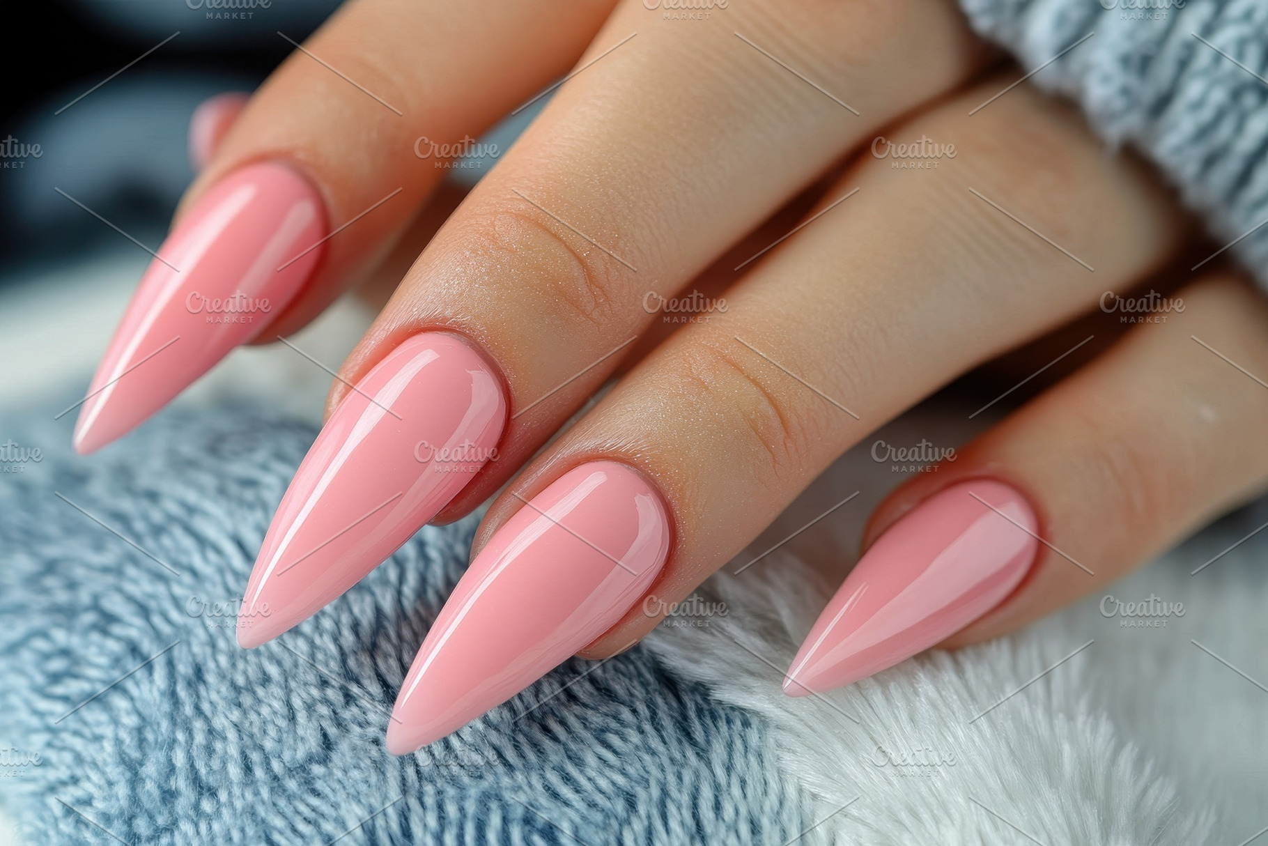 Woman's hand displays long stiletto, a Photo by Pavel_design