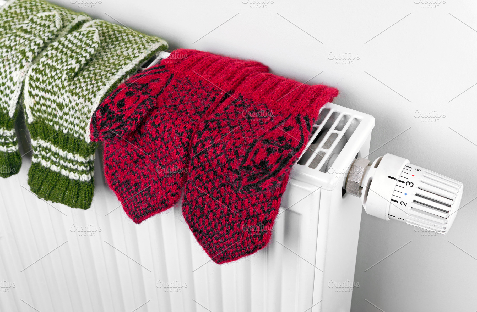 Wool knitted mittens on radiator, a Beauty & Fashion Photo by BOOCYS