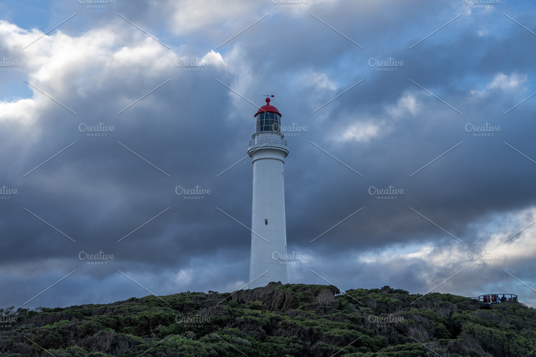 Split Point Lighthouse under cloudy sky at Aireys Inlet, Austral, an Architecture Photo by GoodGoods